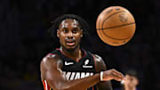 Nov 2, 2025; Los Angeles, California, USA; Miami Heat guard Davion Mitchell (45) passes the ball against the Los Angeles Lakers during the first half at Crypto.com Arena. Mandatory Credit: Jonathan Hui-Imagn Images