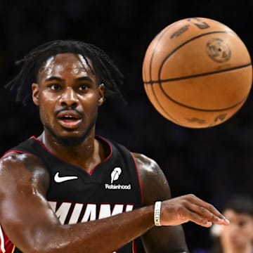 Nov 2, 2025; Los Angeles, California, USA; Miami Heat guard Davion Mitchell (45) passes the ball against the Los Angeles Lakers during the first half at Crypto.com Arena. Mandatory Credit: Jonathan Hui-Imagn Images