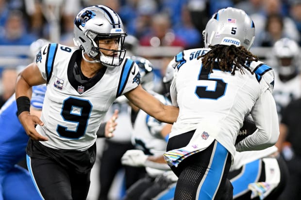 Carolina Panthers quarterback Bryce Young (9) hands the ball to wide receiver Laviska Shenault Jr.