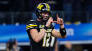 Dec 29, 2023; Arlington, TX, USA; Missouri Tigers quarterback Brady Cook (12) reacts after a touchdown during the second half against the Ohio State Buckeyes at AT&T Stadium. 