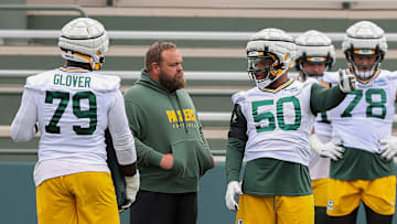 Green Bay Packers offensive lineman Zach Tom (50) talks with offensive line coach Luke Butkus between drill reps during practice on Thursday, August 8, 2024, at Ray Nitschke Field in Ashwaubenon, Wis. 
Tork Mason/USA TODAY NETWORK-Wisconsin