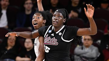 Mar 22, 2025; Los Angeles, California, USA;  California Golden Bears forward Ugonne Onyiah (0) and Mississippi State Bulldogs center Madina Okot (15) fight for position under the basket during the 2nd quarter of an NCAA Tournament game at Galen Center. Mandatory Credit: Robert Hanashiro-Imagn Images