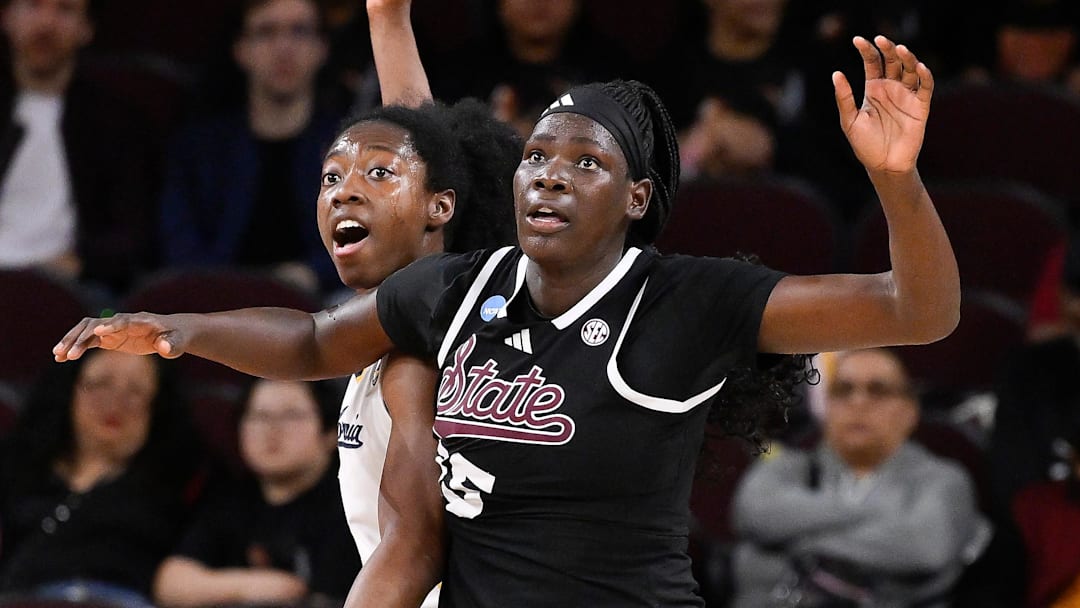 Mar 22, 2025; Los Angeles, California, USA;  California Golden Bears forward Ugonne Onyiah (0) and Mississippi State Bulldogs center Madina Okot (15) fight for position under the basket during the 2nd quarter of an NCAA Tournament game at Galen Center. Mandatory Credit: Robert Hanashiro-Imagn Images