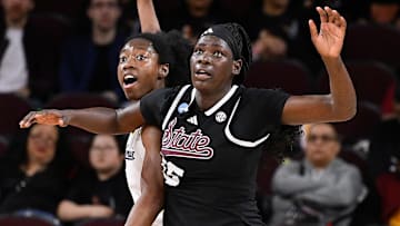 Mar 22, 2025; Los Angeles, California, USA;  California Golden Bears forward Ugonne Onyiah (0) and Mississippi State Bulldogs center Madina Okot (15) fight for position under the basket during the 2nd quarter of an NCAA Tournament game at Galen Center. Mandatory Credit: Robert Hanashiro-Imagn Images