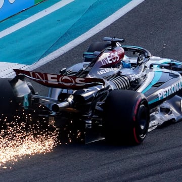 May 4, 2024; Miami Gardens, Florida, USA; Mercedes driver George Russell (63) scrapes the track as sparks fly racing into turn five during qualifying for the Miami Grand Prix at Miami International Autodrome. Mandatory Credit: John David Mercer-USA TODAY Sports