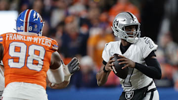 Nov 6, 2025; Denver, Colorado, USA; Las Vegas Raiders quarterback Geno Smith (7) drops back to pass against the Denver Broncos during the first half at Empower Field at Mile High. Mandatory Credit: Isaiah J. Downing-Imagn Images