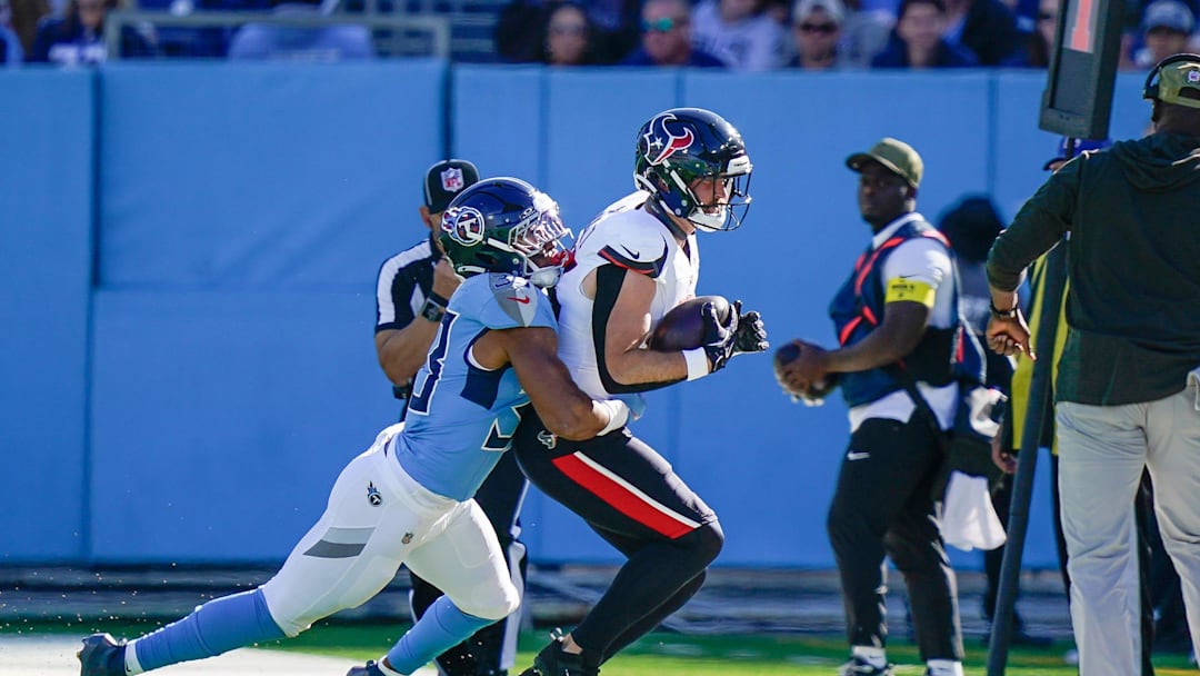 Houston Texans tight end Dalton Schultz (86) is tackled by Tennessee Titans linebacker Cedric Gray (33) during the second quarter at Nissan Stadium in Nashville, Tenn., Sunday, Nov. 16, 2025. Houston Texans tight end Dalton Schultz (86) is tackled by Tennessee Titans linebacker Cedric Gray (33) during the second quarter at Nissan Stadium in Nashville, Tenn., Sunday, Nov. 16, 2025.