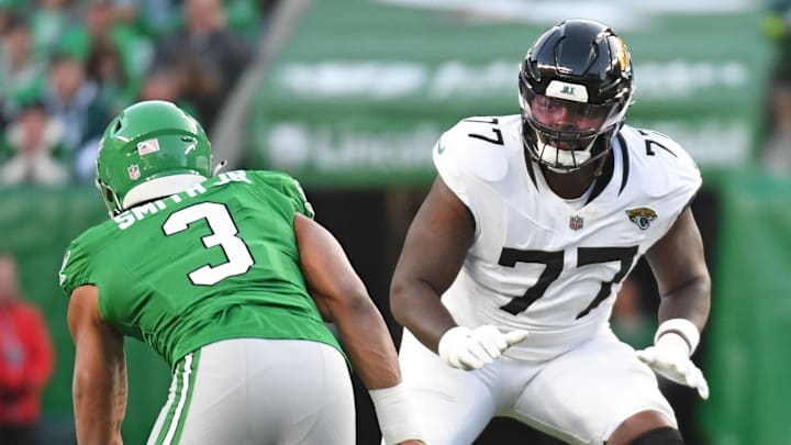 Nov 3, 2024; Philadelphia, Pennsylvania, USA; Jacksonville Jaguars offensive tackle Anton Harrison (77) prepares to block Philadelphia Eagles linebacker Nolan Smith Jr. (3) at Lincoln Financial Field. Mandatory Credit: Eric Hartline-Imagn Images Nov 3, 2024; Philadelphia, Pennsylvania, USA; Jacksonville Jaguars offensive tackle Anton Harrison (77) prepares to block Philadelphia Eagles linebacker Nolan Smith Jr. (3) at Lincoln Financial Field. Mandatory Credit: Eric Hartline-Imagn Images