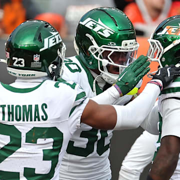 Oct 26, 2025; Cincinnati, Ohio, USA;  New York Jets cornerback Michael Carter II (30), cornerback Azareye'h Thomas (23) and cornerback Jarvis Brownlee Jr. (29) celebrates the game win at the end of the fourth quarter against the Cincinnati Bengals at Paycor Stadium. Mandatory Credit: Joseph Maiorana-Imagn Images
