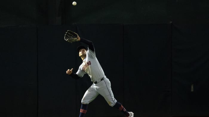 Mar 28, 2024; Oakland, California, USA; Cleveland Guardians center fielder Tyler Freeman (2) makes a running catch of a line drive off the bat of Oakland Athletics left fielder Seth Brown during the seventh inning at Oakland-Alameda County Coliseum. Mandatory Credit: D. Ross Cameron-USA TODAY Sports