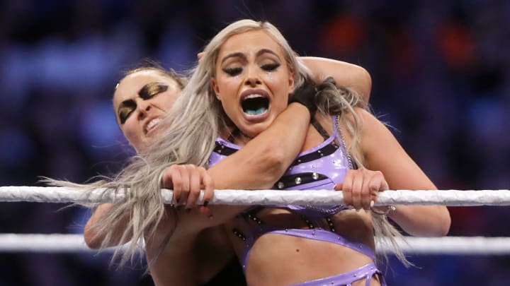 Liv Morgan and Ronda Rousey compete during the 2022 WWE SummerSlam.