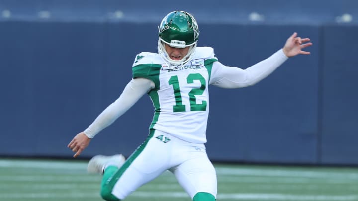 Sep 7, 2019; Winnipeg, Manitoba, CAN; Saskatchewan Roughriders kicker Brett Lauther (12) kicks the ball after Saskatchewan Roughriders touchdown during a Canadian Football League game against the Winnipeg Blue Bombers at Investors Group Field. Winnipeg Blue Bombers win 35-10. Mandatory Credit: Bruce Fedyck-USA TODAY Sports