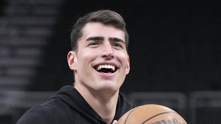 Mar 2, 2026; Milwaukee, Wisconsin, USA; Boston Celtics center Luka Garza (52) shoots during pregame warmups before a game against the Milwaukee Bucks at Fiserv Forum. Mandatory Credit: Michael McLoone-Imagn Images