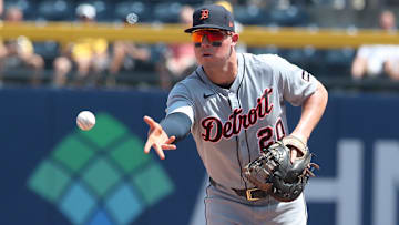 Jul 23, 2025; Pittsburgh, Pennsylvania, USA;  Detroit Tigers first baseman Spencer Torkelson (20) flips the ball to first base for an out against Pittsburgh Pirates right fielder Bryan Reynolds (not pictured) during the seventh inning at PNC Park. Mandatory Credit: Charles LeClaire-Imagn Images