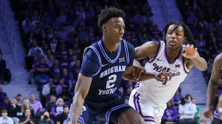 Feb 24, 2024; Manhattan, Kansas, USA; Brigham Young Cougars guard Jaxson Robinson (2) dribbles against Kansas State Wildcats guard Dai Dai Ames (4) during the second half at Bramlage Coliseum. Mandatory Credit: Scott Sewell-USA TODAY Sports