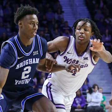 Feb 24, 2024; Manhattan, Kansas, USA; Brigham Young Cougars guard Jaxson Robinson (2) dribbles against Kansas State Wildcats guard Dai Dai Ames (4) during the second half at Bramlage Coliseum. Mandatory Credit: Scott Sewell-Imagn Images