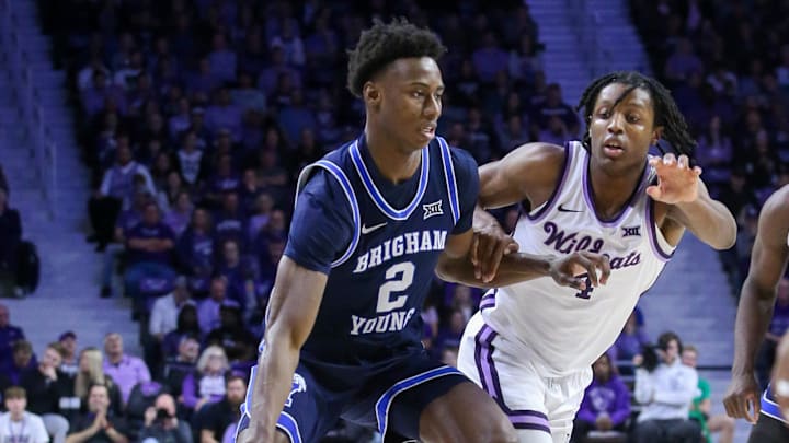 Feb 24, 2024; Manhattan, Kansas, USA; Brigham Young Cougars guard Jaxson Robinson (2) dribbles against Kansas State Wildcats guard Dai Dai Ames (4) during the second half at Bramlage Coliseum. Mandatory Credit: Scott Sewell-Imagn Images