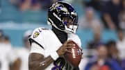 Oct 30, 2025; Miami Gardens, Florida, USA; Baltimore Ravens quarterback Lamar Jackson (8) looks to pass against the Miami Dolphins in the third quarter at Hard Rock Stadium. Mandatory Credit: Nathan Ray Seebeck-Imagn Images