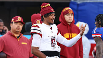Nov 3, 2024; East Rutherford, New Jersey, USA; New York Giants wide receiver Malik Nabers (1) talks with Washington Commanders quarterback Jayden Daniels (5) during a time out during the second half at MetLife Stadium. Mandatory Credit: Vincent Carchietta-Imagn Images