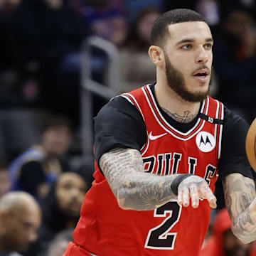 Feb 2, 2025; Detroit, Michigan, USA; Chicago Bulls guard Lonzo Ball (2) passes in the first half against the Detroit Pistons at Little Caesars Arena. Mandatory Credit: Rick Osentoski-Imagn Images