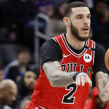 Feb 2, 2025; Detroit, Michigan, USA; Chicago Bulls guard Lonzo Ball (2) passes in the first half against the Detroit Pistons at Little Caesars Arena. Mandatory Credit: Rick Osentoski-Imagn Images