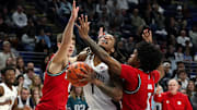 Penn State Nittany Lions guard Ace Baldwin Jr. pushes his way to the basket as Rutgers Scarlet Knights guard Jamichael Davis (1) and guard Jordan Derkack (0) defend during the first half at Bryce Jordan Center. 