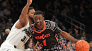 Mar 13, 2013; New York, NY, USA; Cincinnati Bearcats guard Cashmere Wright (1) drives past Providence Friars guard Vincent Council (32) during the second half of a Big East tournament game at Madison Square Garden. Mandatory Credit: Brad Penner-Imagn Images