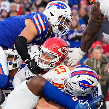 Nov 2, 2025; Orchard Park, New York, USA; Kansas City Chiefs quarterback Patrick Mahomes (15) is sacked by Buffalo Bills linebacker Terrel Bernard (8) and defensive end Joey Bosa (97) at Highmark Stadium. Mandatory Credit: Gregory Fisher-Imagn Images