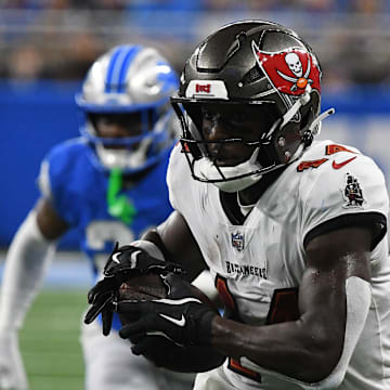 Sep 15, 2024; Detroit, Michigan, USA; Tampa Bay Buccaneers wide receiver Chris Godwin (14) scores a touchdown against the Detroit Lions in the second quarter at Ford Field. Mandatory Credit: Eamon Horwedel-Imagn Images