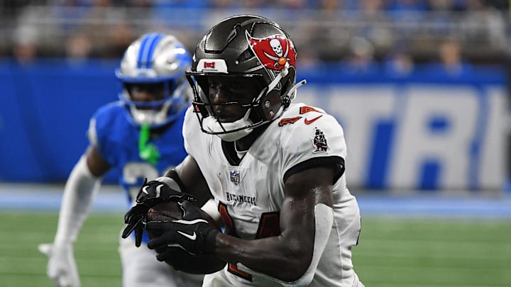 Sep 15, 2024; Detroit, Michigan, USA; Tampa Bay Buccaneers wide receiver Chris Godwin (14) scores a touchdown against the Detroit Lions in the second quarter at Ford Field. Mandatory Credit: Eamon Horwedel-Imagn Images