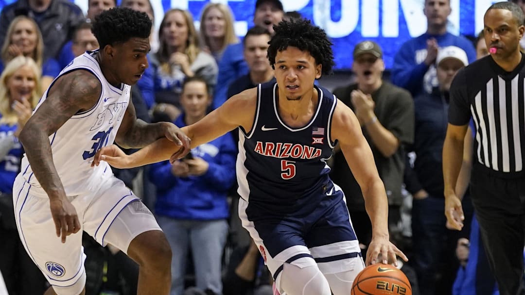 Arizona guard Brayden Burries drives while being defended by BYU forward Kennard Davis Jr. during the second half.
