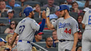 Dodgers right fielder Matt Kemp (27) high fives with starting pitcher Rich Hill (44) after scoring a run against the Atlanta Braves during the fifth inning at SunTrust Park. 