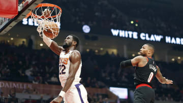 Dec 14, 2021; Portland, Oregon, USA; Phoenix Suns center Deandre Ayton (22) dunks the ball past