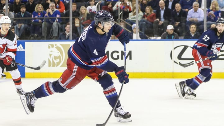 Apr 3, 2024; New York, New York, USA; New York Rangers defenseman Braden Schneider (4) attempts a shot on goal in the third period against the New Jersey Devils at Madison Square Garden. Mandatory Credit: Wendell Cruz-USA TODAY Sports