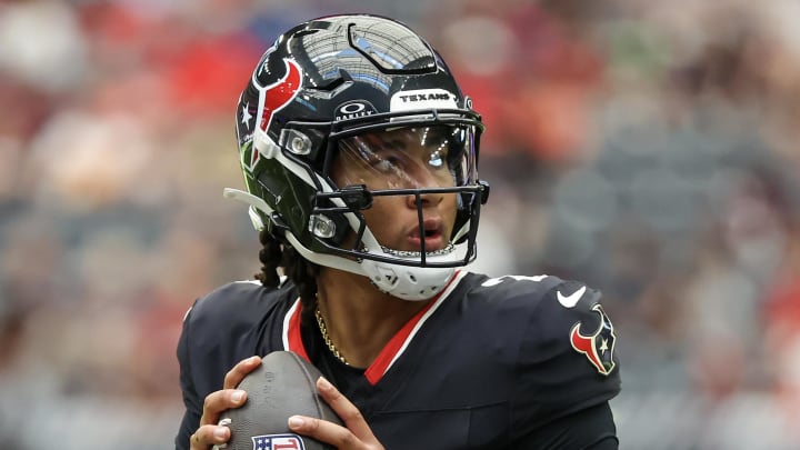 Aug 17, 2024; Houston, Texas, USA; Houston Texans quarterback C.J. Stroud (7) drops back to pass against the New York Giants in the first quarter at NRG Stadium. Mandatory Credit: Thomas Shea-USA TODAY Sports