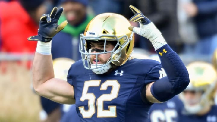 Nov 2, 2019; South Bend, IN, USA; Notre Dame Fighting Irish linebacker Bo Bauer (52) exhorts the crowd before the game against the Virginia Tech Hokies at Notre Dame Stadium. Mandatory Credit: Matt Cashore-USA TODAY Sports