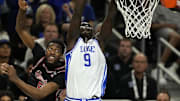 Apr 5, 2025; San Antonio, TX, USA; Duke Blue Devils center Khaman Maluach (9) shoots the ball over Houston Cougars forward Ja'Vier Francis (5) during the second half in the semifinals of the men's Final Four of the 2025 NCAA Tournament at Alamodome. Mandatory Credit: Scott Wachter-Imagn Images
