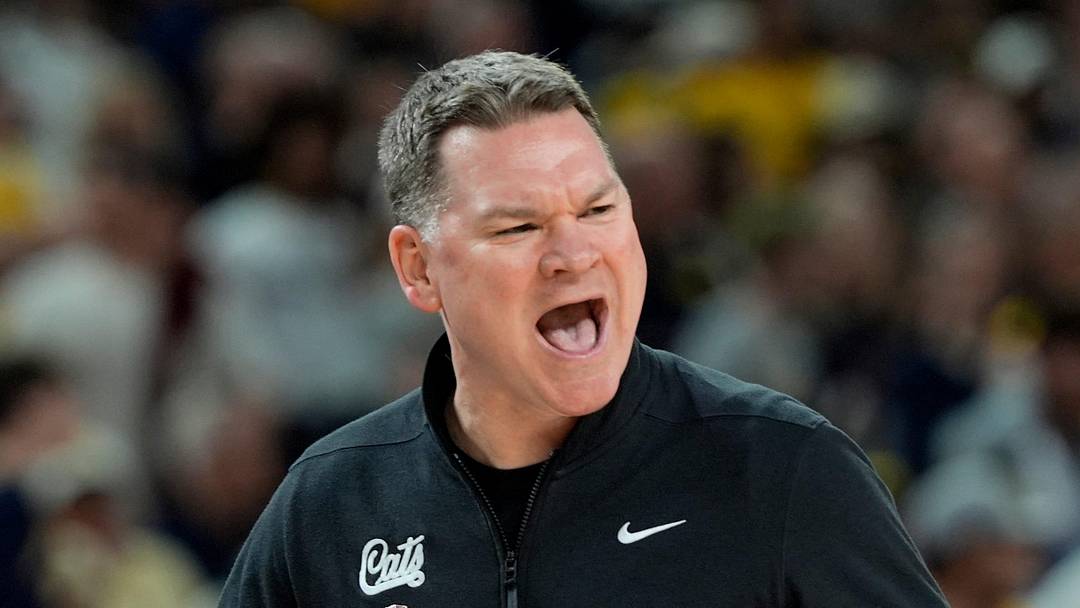 Arizona head coach Tommy Lloyd shouts toward the court in the first half of their Final Four game against Michigan at Lucas Oil Stadium in Indianapolis on Saturday, April 4, 2026.