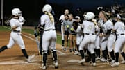 Purdue Boilermakers starting pitcher/relief pitcher Julia Gossett (33) rounds the bases after hitting a home run