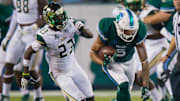 Oct 21, 2017; New Orleans, LA, USA; Tulane Green Wave wide receiver Terren Encalade (5) is tackled by South Florida Bulls cornerback Mazzi Wilkins (23) during the second half at Yulman Stadium. South Florida won 34-28. Mandatory Credit: Stephen Lew-Imagn Images