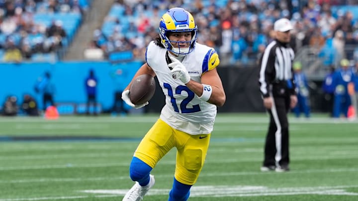 Nov 30, 2025; Charlotte, North Carolina, USA; Los Angeles Rams wide receiver Puka Nacua (12) runs after making a catch during the first quarter against the Carolina Panthers at Bank of America Stadium. Mandatory Credit: Jim Dedmon-Imagn Images