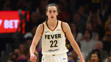 Jun 30, 2024; Phoenix, Arizona, USA; Indiana Fever guard Caitlin Clark (22) against the Phoenix Mercury during a WNBA game at Footprint Center.