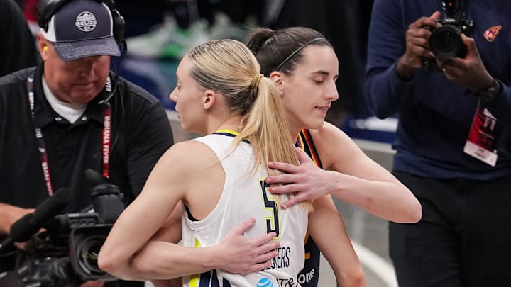 Indiana Fever guard Caitlin Clark (22) and Dallas Wings guard Paige Bueckers (5) hug Sunday, July 13, 2025, ahead of the game at Gainbridge Fieldhouse in Indianapolis.