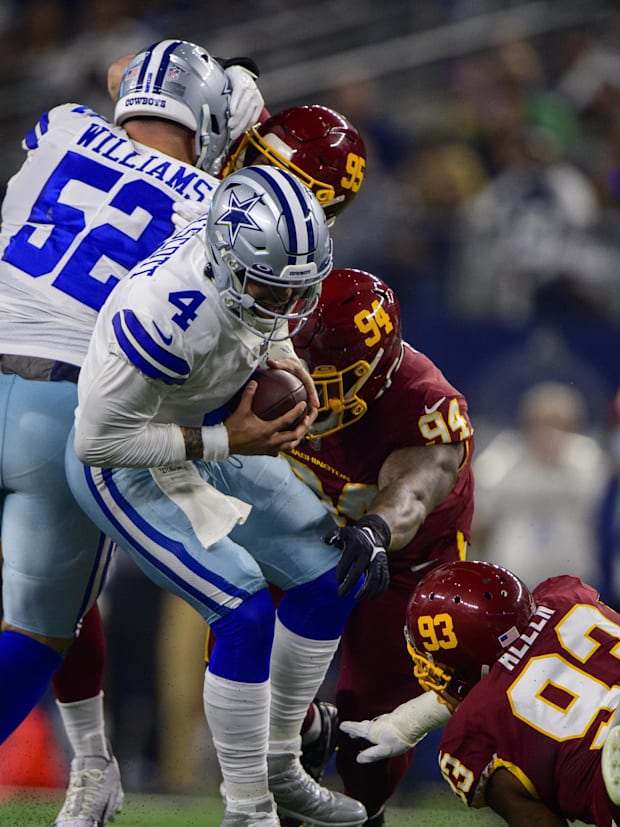 Dallas Cowboys quarterback Dak Prescott (4) and Washington Football Team defensive tackle Daron Payne (94)
