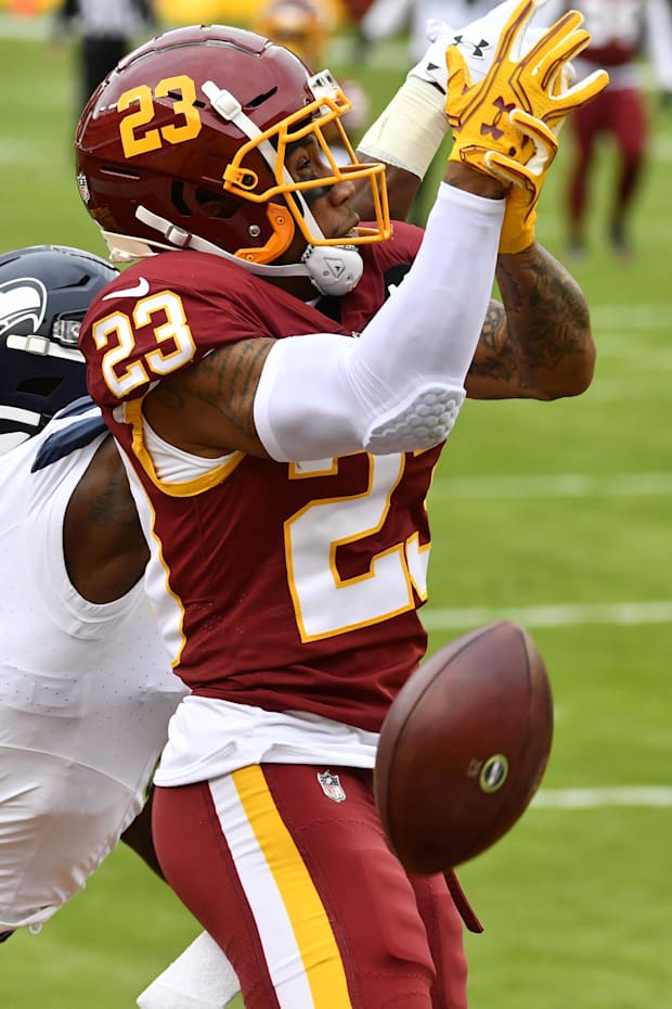Washington Football Team cornerback Ronald Darby breaks up a pass intended for Seattle Seahawks wide receiver DK Metcalf