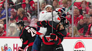 May 12, 2025; Raleigh, North Carolina, USA; Washington Capitals left wing Alex Ovechkin (8) checks Carolina Hurricanes defenseman Jalen Chatfield (5) during the second period in game four of the second round of the 2025 Stanley Cup Playoffs at Lenovo Center. Mandatory Credit: James Guillory-Imagn Images
