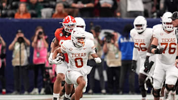 Dec 7, 2024; Atlanta, GA, USA; Texas Longhorns wide receiver DeAndre Moore Jr. (0) makes a catch against the Georgia Bulldogs during the first half in the 2024 SEC Championship game at Mercedes-Benz Stadium. Mandatory Credit: Dale Zanine-Imagn Images
