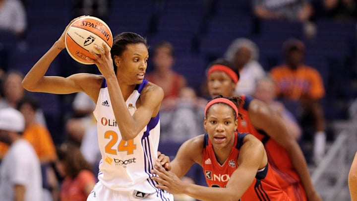 Jun. 20, 2012; Phoenix, AZ, USA; Phoenix Mercury guard DeWanna Bonner (24) handles the ball against the Washington Mystics forward Monique Currie (25) during the second half at US Airways Center. The Mercury defeated the Mystics 79-77. Mandatory Credit: Jennifer Stewart-Imagn Images