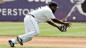 July 23, 2006; Detroit, MI, USA; Detroit Tigers first baseman (25) Dmitri Young flips the ball to first base to get Oakland Athletics first baseman (33) Nick Swisher (not pictured) in the 4th inning at Comerica Park. Mandatory Credit: Tom Szczerbowski-Imagn Images Copyright Tom Szczerbowski