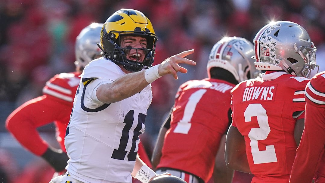 Michigan quarterback Davis Warren (16) celebrates a first down against Ohio State during the second half at Ohio Stadium in Columbus, Ohio on Saturday, Nov. 30, 2024.